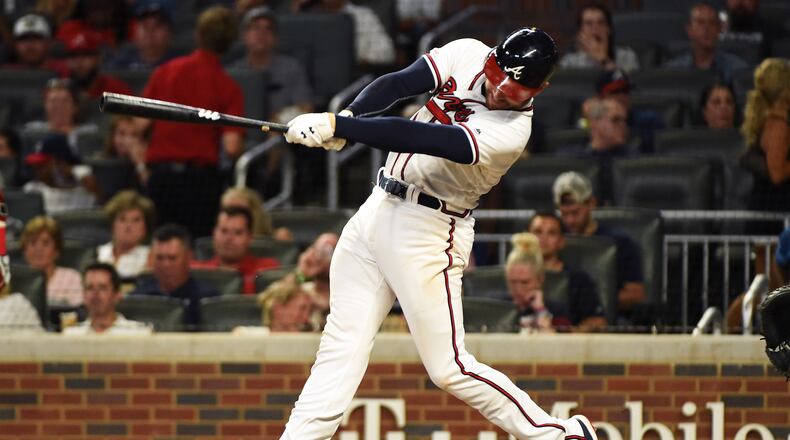 Freddie Freeman hits a home run in the fifth inning against the Miami Marlins at SunTrust Park on Tuesday night.