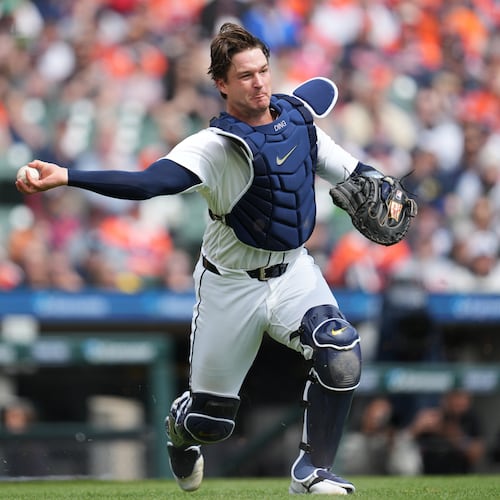 Detroit Tigers catcher Dillon Dingler throws to first base for an out on a St. Louis Cardinals' Victor Scott II bunt in the first inning of a baseball game Saturday, April 4, 2026, in Detroit. (AP Photo/Paul Sancya)