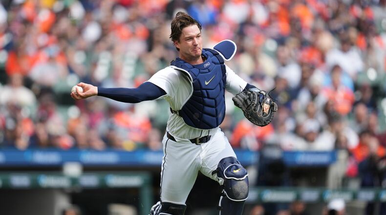 Detroit Tigers catcher Dillon Dingler throws to first base for an out on a St. Louis Cardinals' Victor Scott II bunt in the first inning of a baseball game Saturday, April 4, 2026, in Detroit. (AP Photo/Paul Sancya)