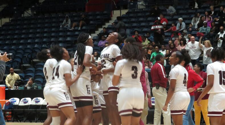 The Forest Park Lady Panthers celebrate their 46-30 victory over the Glynn Academy Terrors in the Class AAAAAA state championship on Saturday, March 7, 2020 at the Macon Centreplex. (Adam Krohn for the AJC)