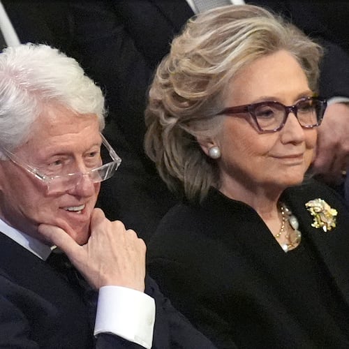 FILE - Former President Bill Clinton and former Secretary of State Hillary Clinton listen during the state funeral for former President Jimmy Carter at Washington National Cathedral in Washington, Jan. 9, 2025. (AP Photo/Jacquelyn Martin, File)