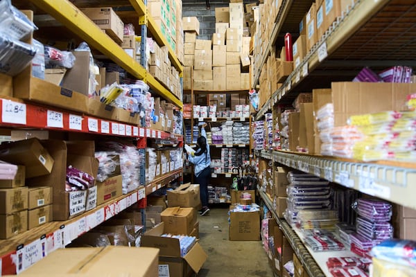 An employee at Besco Beauty International, a beauty products wholesaler in Doraville, Ga., collects products from the shelves to fulfill an order, Monday, May 5, 2025, (AP Photo/Stephanie Scarbrough)