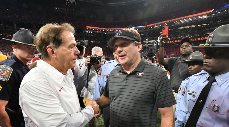 Alabama's head coach Nick Saban and Georgia's head coach Kirby Smart shake hands after Alabama beat Georgia during the Southeastern Conference championship at Mercedes-Benz Stadium in Atlanta on Dec. 4, 2021. (Hyosub Shin/The Atlanta Journal-Constitution/TNS)