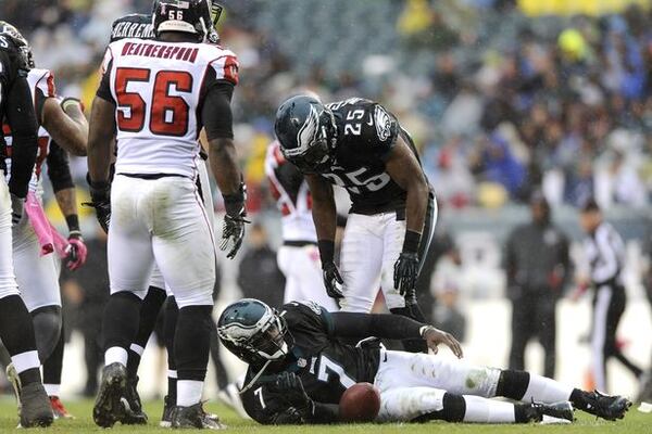 Michael Vick in an October 2012 loss to the Falcons. (Michael Perez/AP)