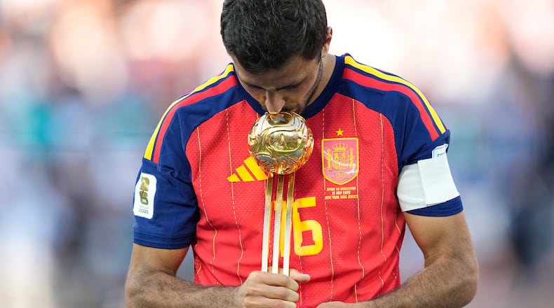 Spain's Rodri poses with the tournament's best player award at the end of the World Cup final soccer match between Spain and Argentina in East Rutherford, N.J., near New York, Sunday, July 19, 2026. (AP Photo/Ashley Landis)