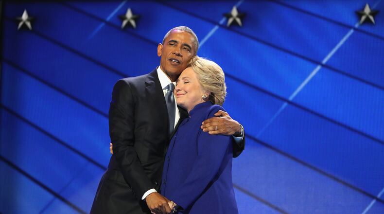 PHILADELPHIA, PA - JULY 27: US President Barack Obama and Democratic presidential candidate Hillary Clinton embrace on the third day of the Democratic National Convention at the Wells Fargo Center, July 27, 2016 in Philadelphia, Pennsylvania. (Photo by Joe Raedle/Getty Images)