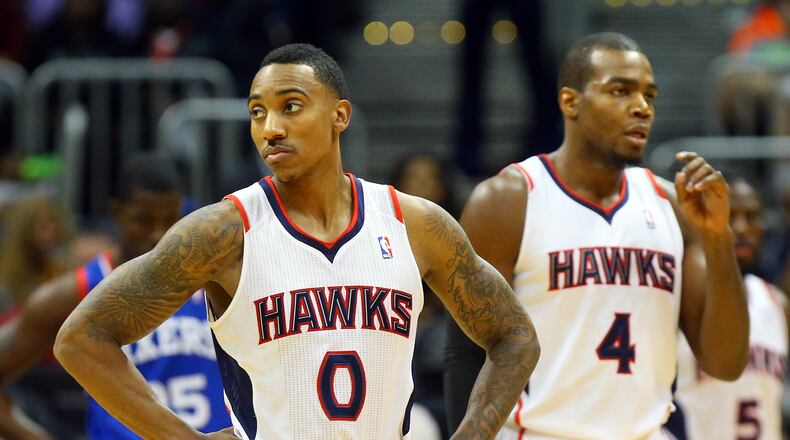 033114 ATLANTA: Hawks Jeff Teague (left) and Paul Millsap perpare to defend against the Sixers during the first half of an NBA basketball game on Monday, March 31, 2014, in Atlanta. CURTIS COMPTON / CCOMPTON@AJC.COM Jeff Teague, Paul Millsap and Hawks will be significant underdogs vs. Pacers.