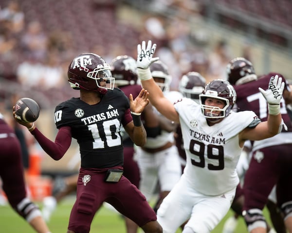 Texas A&M defensive tackle Landon Rink (99) rushes Texas A&M quarterback Marcel Reed (10) during the team's NCAA college football spring game Saturday, April 19, 2025, in College Station, Texas. (Meredith Seaver/College Station Eagle via AP)