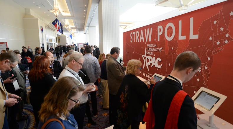 Guests queue to place their votes in an electronic straw poll for possible presidential candidates at the Conservative Political Action Conference (CPAC) in National Harbor, Md., on Feb. 28, 2015. REUTERS/Mike Theiler