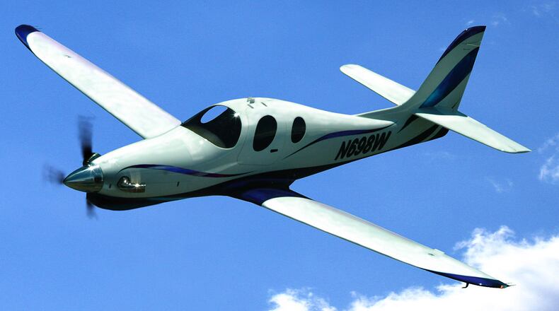 A plane crash in Lone Tree, Colorado, on Wednesday left a Georgia couple and a dog dead at the scene, according to South Metro Fire Rescue. A single-engine Lancair Evolution (similar to the one shown) hit power lines and crashed shortly before 2 p.m. while on approach to Centennial Airport, the Federal Aviation Administration told The Denver Post. (Image: Wikimedia Commons)