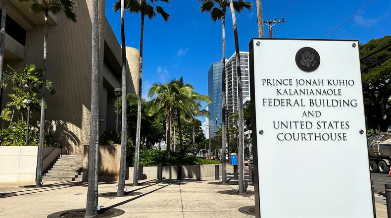 FILE - A sign for the Prince Jonah Kuhio Kalanianaole Federal Building and Courthouse is displayed outside the courthouse on Jan. 22, 2024, in Honolulu. (AP Photo/Jennifer Kelleher, File)