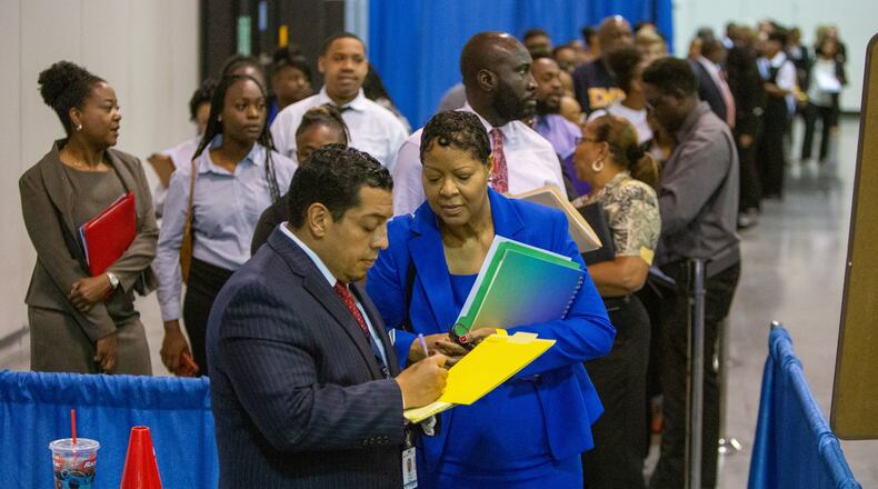 Delta Global Service hiring manager Donny Pesantes (left) talked to Karen Crawford during the Hartsfield-Jackson International Airport job fair at the Georgia International Convention Center on Tuesday, Oct. 8, 2019. The event featured more than 60 of the airport community’s top employers offering 2,000-plus jobs. (Photo by Phil Skinner for the AJC)
