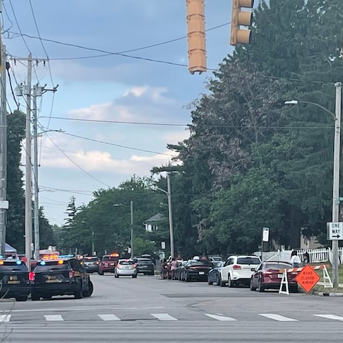 Police officers work at the scene of a shooting near a festival in Toledo, Ohio on Saturday, June 6, 2026. (WTVG via AP)