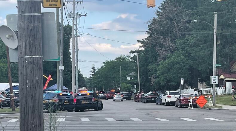 Police officers work at the scene of a shooting near a festival in Toledo, Ohio on Saturday, June 6, 2026. (WTVG via AP)