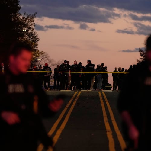 Emergency personnel keep a presence following the shooting of two National Guard soldiers near the White House, Wednesday, Nov. 26, 2025, in Washington. (AP Photo/Mark Schiefelbein)