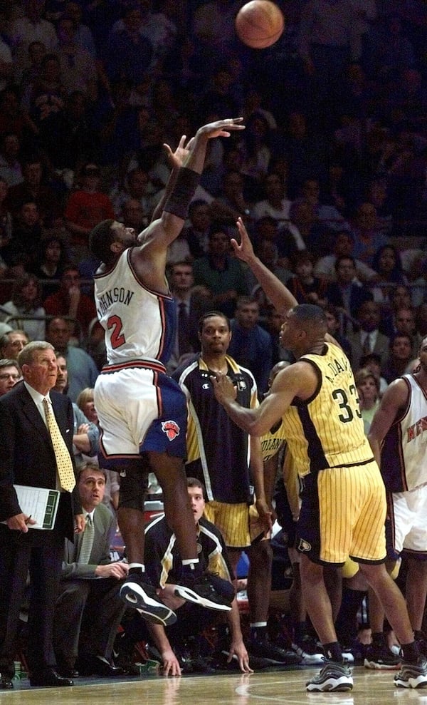 New York Knicks Larry Johnson (2) lets a three point shot go over Indiana Pacers Antonio Davis (33) during the final seconds of Game 3 of the Eastern Conference finals Saturday, June 5, 1999, at New York's Madison Square Garden. Johnson's basket was good and Davis fouled him on the play. Johnson hit his free throw with 5.7 second left to lift the Knicks to a stunning 92-91 victory. (AP Photo/Ron Frehm)