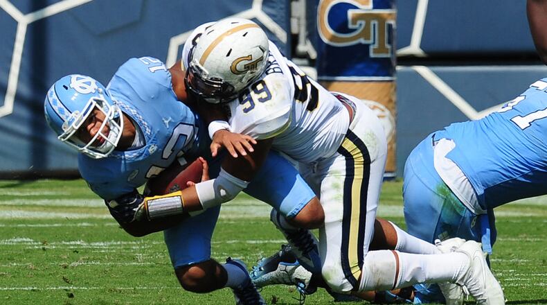 ATLANTA, GA - SEPTEMBER 30: Chazz Surratt #12 of the North Carolina Tar Heels is sacked by Desmond Branch #99 of the Georgia Tech Yellow Jackets on September 30, 2017 in Atlanta, Georgia. Photo by Scott Cunningham/Getty Images)