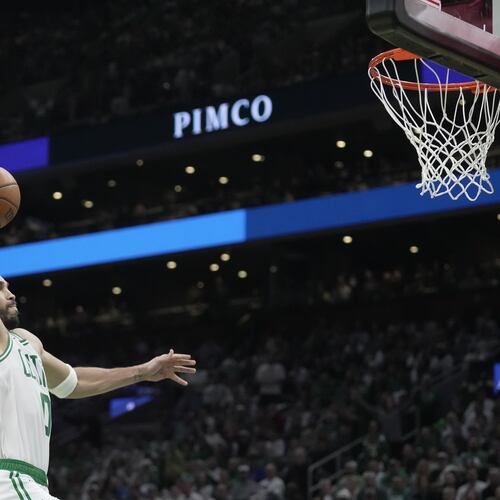Boston Celtics forward Jayson Tatum goes in for a dunk against the Philadelphia 76ers during the first half in Game 1 of a first-round NBA playoffs basketball game, Sunday, April 19, 2026, in Boston. (AP Photo/Robert F. Bukaty)
