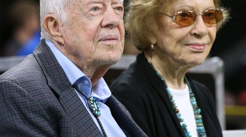 Former President Jimmy Carter, left, and first lady Rosalynn Carter look on during an NFL game between the Atlanta Falcons and Cincinnati Bengals on Sept. 30, 2018, in Atlanta. (Curtis Compton/The Atlanta Journal-Constitution/TNS)