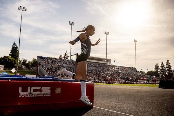 AB Hernandez, a transgender student at Jurupa Valley High School, leaps off the crash pad while competing in high jump at the California high school track-and-field championships in Clovis, Calif., Saturday, May 31, 2025. (Stephen Lam/San Francisco Chronicle via AP)