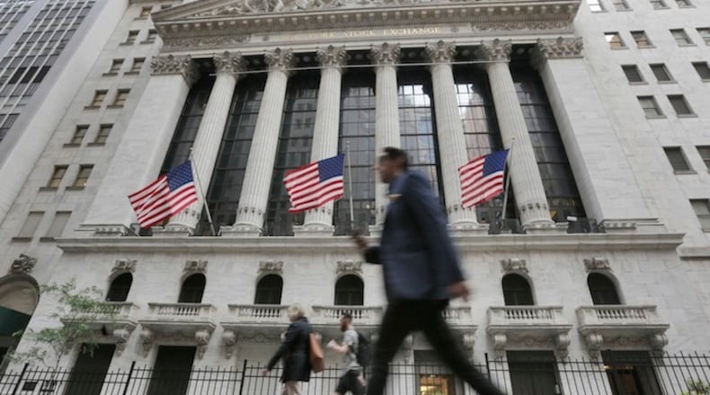 FILE - In this Friday, June 24, 2016, file photo, people walk by the New York Stock Exchange. Global stocks mostly rose Friday, July 1, as authorities stepped in to ease the uncertainty surrounding the British vote to leave the European Union. Investors flocked to equities in the face of narrowing choices for investments amid low or negative interest rates on many bonds. (AP Photo/Richard Drew, File)