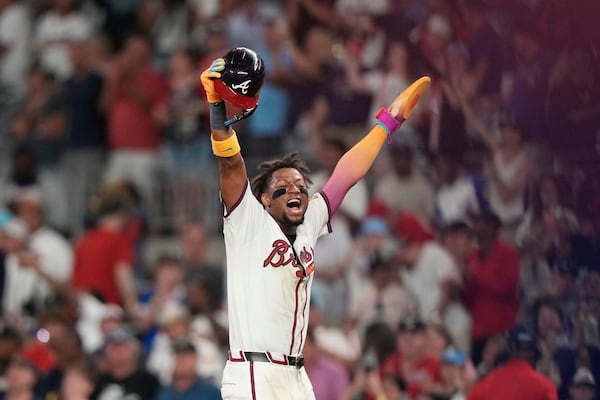 Braves outfielder Ronald Acuña Jr. celebrates Tuesday's 10th-inning win over the Mets. 