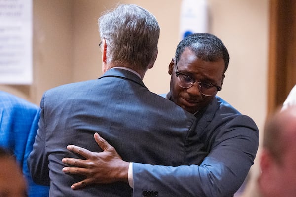 Former Memphis Police Department officer Justin Smith Jr., right, becomes emotional as he hugs Michael Stengel, left, the defense attorney for fellow former officer Demetrius Haley, after Smith and the other two former officers were found not guilty on all charges by the jury on the ninth day of the trial for the death of Tyre Nichols in Memphis, Tenn., on Wednesday, May 7, 2025. (Chris Day/Commercial Appeal/USA Today Network via AP, Pool)