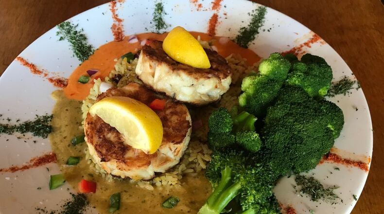 The 100% Lump Crab Cakes at Spondivits contain zero filler. What’s the secret? A little bit of heavy cream, just enough to help moisten and bind it, before setting the mix into ring molds. LIGAYA FIGUERAS / LFIGUERAS@AJC.COM