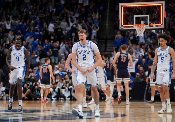 Duke forward Cooper Flagg (2) reacts after making a three point basket against Arizona to end the first half of a Sweet 16 round NCAA college basketball tournament game, Thursday, March 27, 2025, in Newark, N.J. (AP Photo/Frank Franklin II)