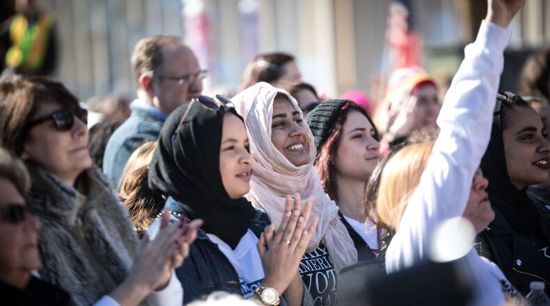 Sumbul Siddiqui, center, a recipient of protection from deportation under the Deferred Action for Childhood Arrivals program, smiles during a Power to the Polls event in January in Atlanta. BRANDEN CAMP/SPECIAL