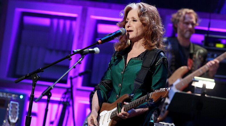 Singer-songwriter Bonnie Raitt will no longer join James Taylor on the first leg of his tour as she is scheduled for an unspecified surgery. (Photo by Terry Wyatt/Getty Images for Americana Music)