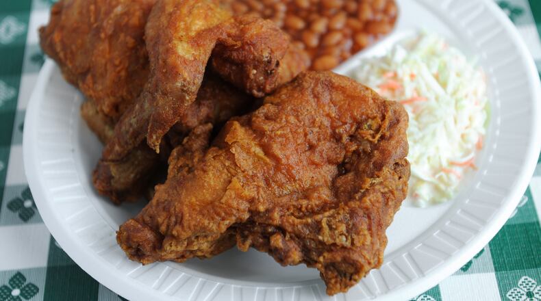 Half Chicken Plate with baked beans, slaw and white bread from Gus's World Famous Fried Chicken. (Becky Stein Photography)