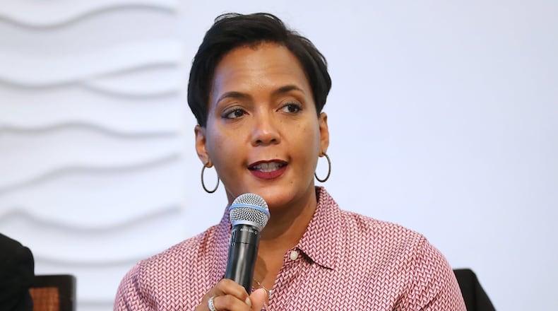 Candidate for Atlanta mayor Keisha Lance Bottoms Curtis vowed Monday to return more than $25,000 in campaign contributions from a longtime city contractor whose office was raided by the FBI last month. Compton/ccompton@ajc.com