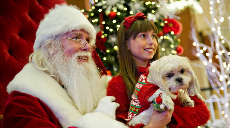 Bailey and her owner Katelyn Vetro take a photo with Santa at Town Center at Cobb in Kennesaw in this 2014 file photo.