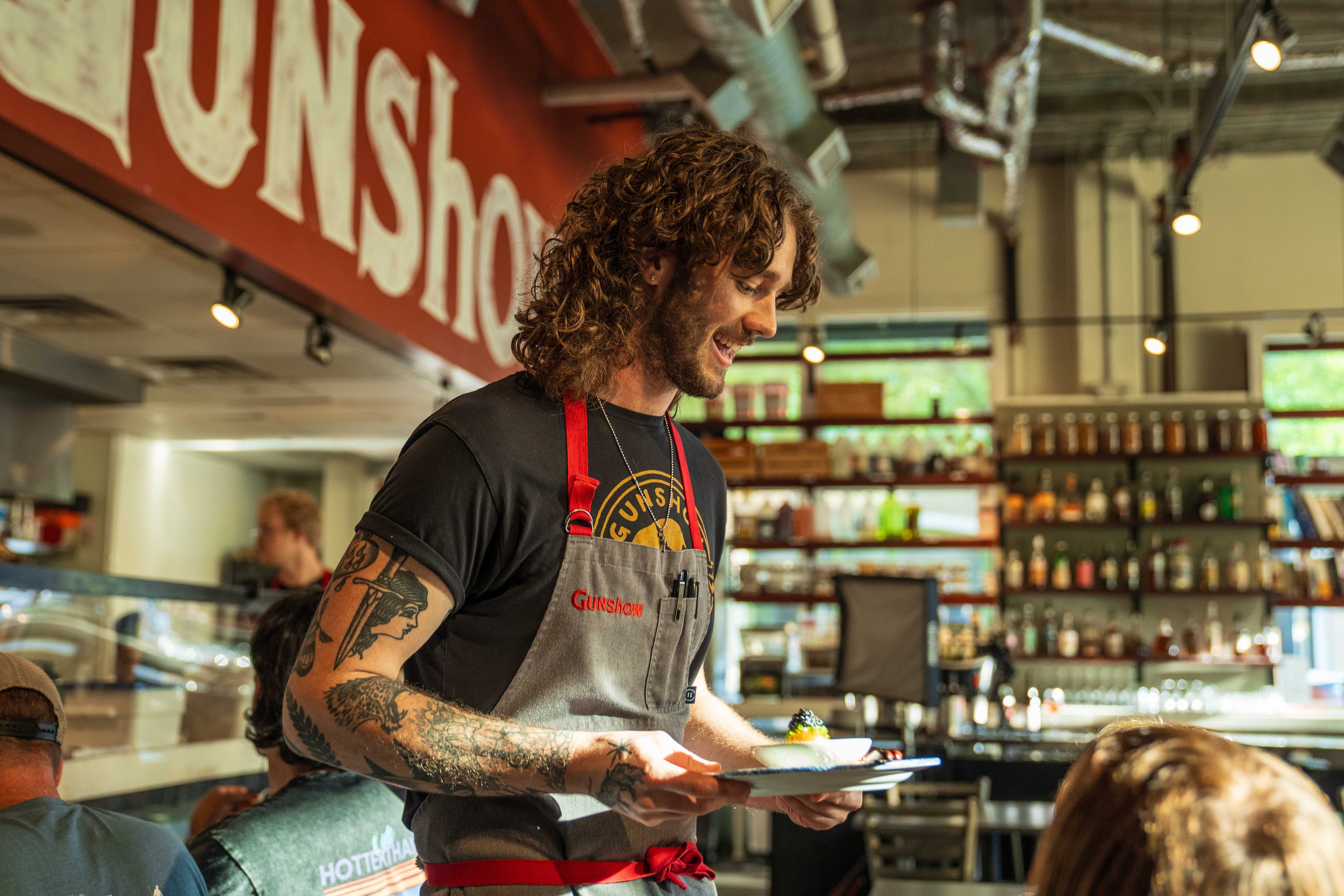 Chefs zoom around the dining room at Gunshow offering the creations to each guest. (Courtesy of Blake Studwell)