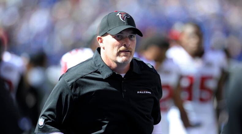 Atlanta Falcons head coach Dan Quinn runs off the field at halftime during an NFL football game against the New York Giants, Sunday, Sept. 20, 2015, in East Rutherford, N.J. (AP Photo/Bill Kostroun)
