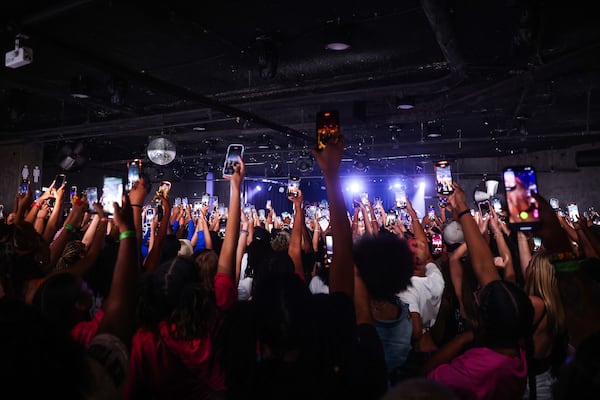 Fans film as BunnaB walks onto the stage at Center Stage on Thursday, June 26, 2025, in Atlanta. The success of “Bunna Summa” continues to stun the rapper, who shared that the song wasn’t one she initially rushed to complete. (Abbey Cutrer/AJC)