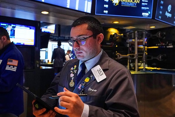 Trader Drew Cohen works on the floor of the New York Stock Exchange, Thursday, May 8, 2025. (AP Photo/Richard Drew)