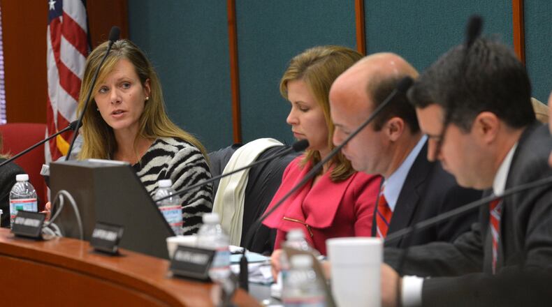 Former state ethics commission director Holly LaBerge, far left, was fired Nov. 8 after a Fulton County judge called her “dishonest and non-transparent” in an order that also fined her $10,000 for withholding a potential piece of evidence in a civil lawsuit filed by her predecessor. LaBerge is the fourth ethics director in four years. BRANT SANDERLIN /BSANDERLIN@AJC.COM