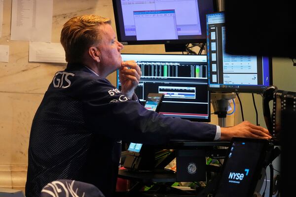 Trader John Bowers works on the floor of the New York Stock Exchange, Tuesday, July 8, 2025. (AP Photo/Richard Drew)