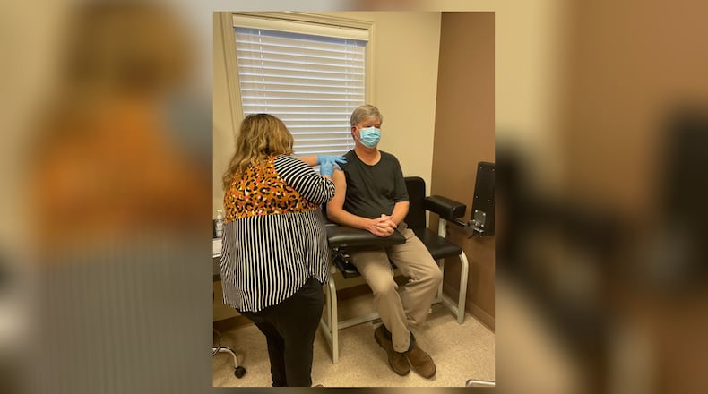 Kristen Cranford administers the Moderna COVID-19 vaccine to Dr. Michael Scott, chief nurse administrator for the Clayton State University School of Nursing, on Monday, Jan. 11, 2021, the first day of spring semester classes.