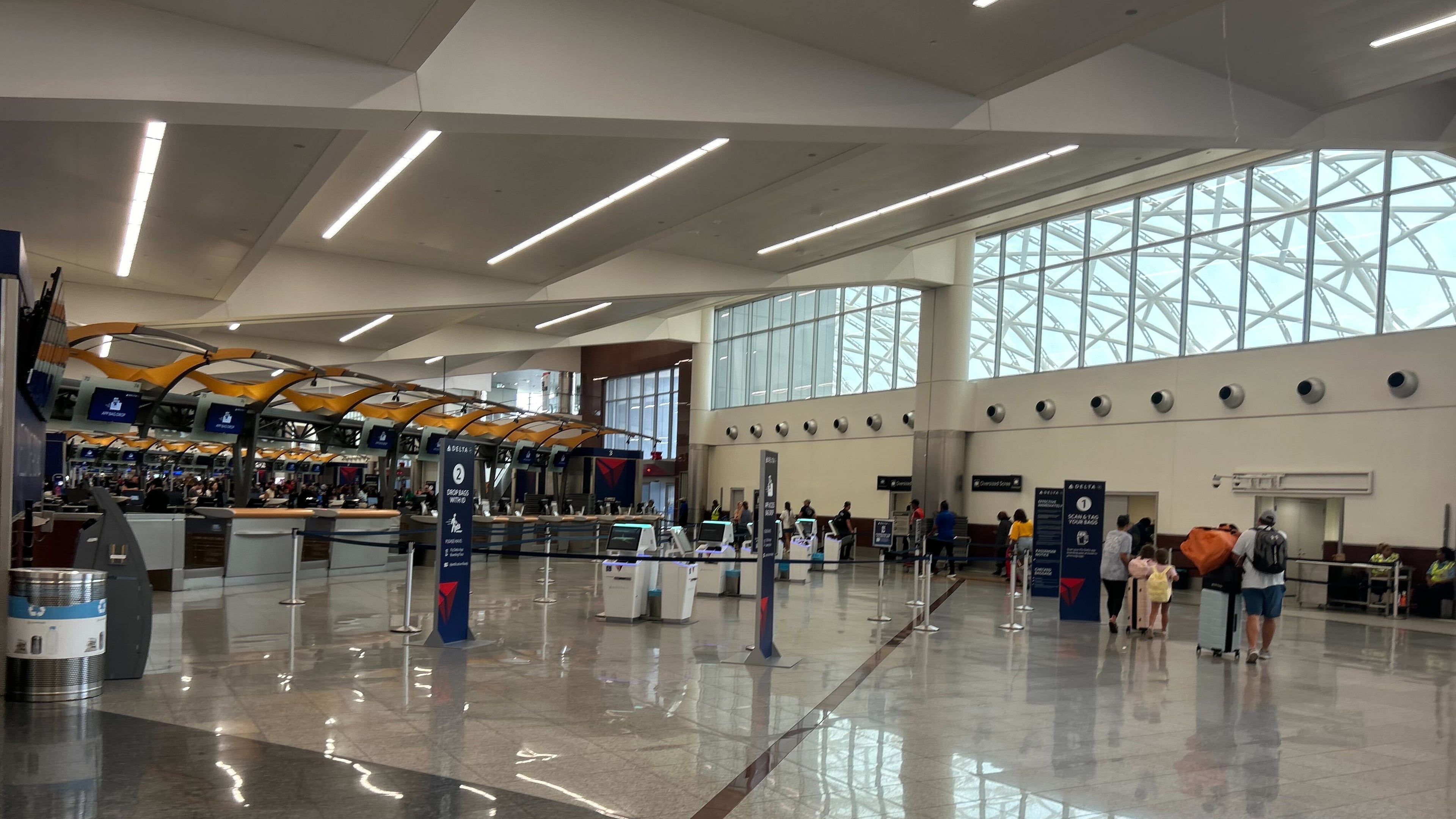 Security wait times at Hartsfield-Jackson Atlanta International Airport ranged from seven to 15 minutes around 3 p.m. Sunday, July 6, 2025, as travelers returned from the long Fourth of July weekend. (Gray Mollenkamp/AJC)
