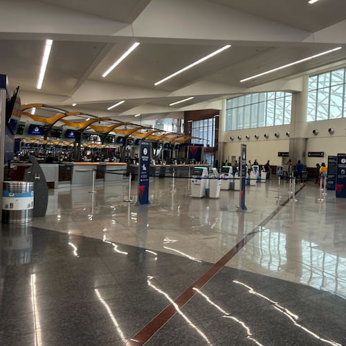 Security wait times at Hartsfield-Jackson Atlanta International Airport ranged from seven to 15 minutes around 3 p.m. Sunday, July 6, 2025, as travelers returned from the long Fourth of July weekend. (Gray Mollenkamp/AJC)