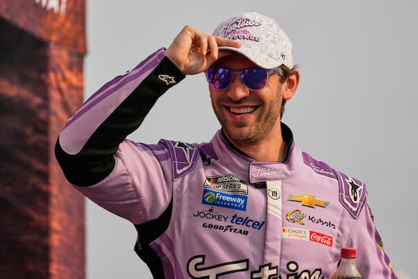 FILE - Daniel Suarez smiles at the NASCAR Cup Series auto race Sunday, June 1, 2025, in Lebanon, Tenn. (AP Photo/George Walker IV, File)