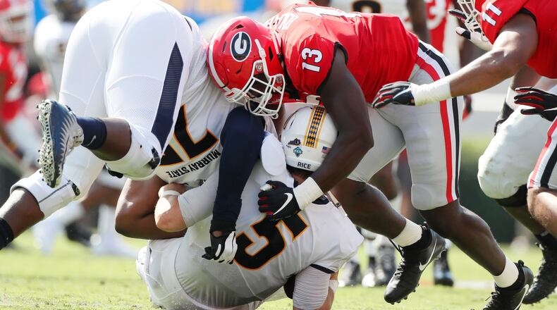 Georgia Bulldogs linebacker Azeez Ojulari (13) sacks  Murray State Racers quarterback Preston Rice (5)  during the first half of today's Georgia vs Murray State football game at Sanford Stadium.  Bob Andres / robert.andres@ajc.com