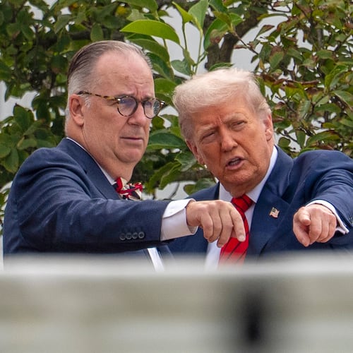 FILE - President Donald Trump, with architect James McCrery, left, surveys the grounds from the roof above the Colonnade that goes to the West Wing of the White House, Aug. 5, 2025, in Washington. (AP Photo/Alex Brandon, File)