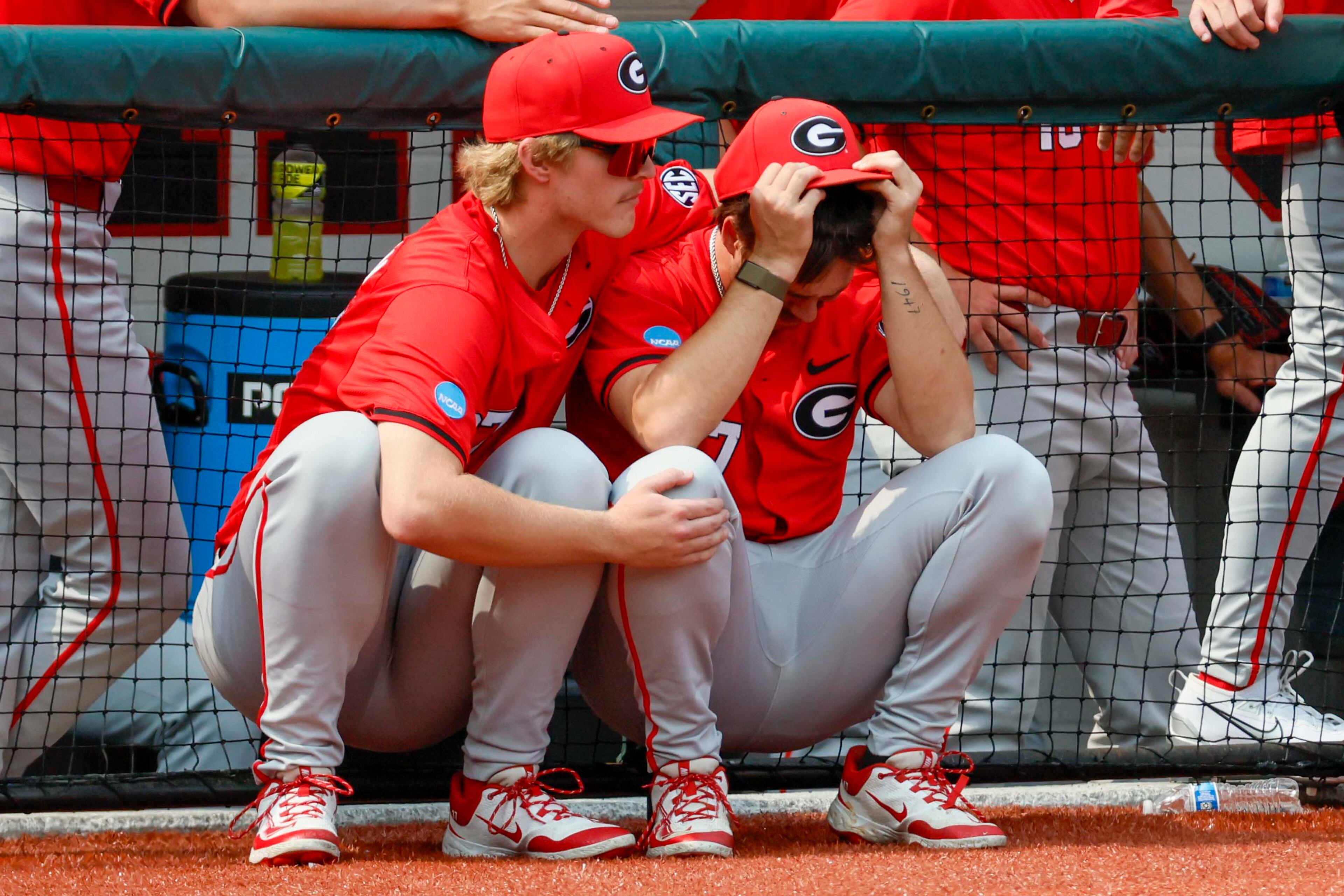 Georgia players react with disbelief after losing against Oklahoma State on a walk-off homer during the ninth inning in their NCAA Regional game at Foley Field, Sunday, June 1, 2025, in Athens, Ga. Oklahoma State defeated Georgia 11-9.
(Miguel Martinez/ AJC)