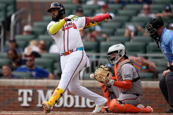 Braves designated hitter Marcell Ozuna takes a swing (and a miss) against the Giants.