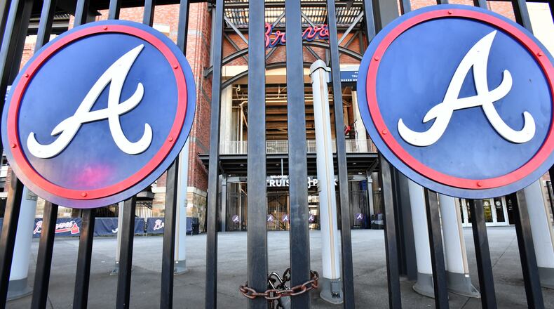 Third-base gates at Truist Park are locked on Wednesday, March 2, 2022.  (Hyosub Shin / Hyosub.Shin@ajc.com)