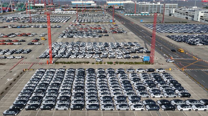 Aerial view of new cars waiting for shipment at a port in Shanghai, China, Wednesday, Jan. 14, 2026. (Chinatopix Via AP)